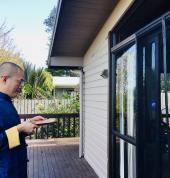 Eric uses compass to check house energy