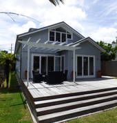 Back of property with pergola and entertainers deck
