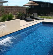 X Trainer 7.15 Slimline Pool in Pacific with water feature