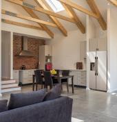 Home extension with exposed roof trusses by MyHome Renovations