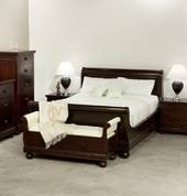 Antoinette sleigh bed suite in dark mahogany stain finish