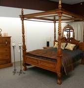 Queen Anne four-poster bed and suite pieces, very organic in the light finish